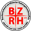 Logo des Bundesverbands zertifizierter Rettungshundestaffeln (BZRH e. V.) mit rotem Kreuz und den Buchstaben BZRH in Rot auf hellem Hintergrund, umrandet von schwarzem Text.